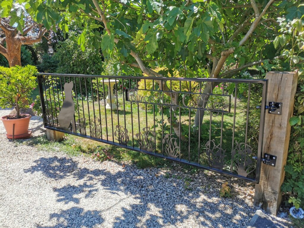 Bespoke iron driveway gate with plasma cut unique design installed near saffron walden