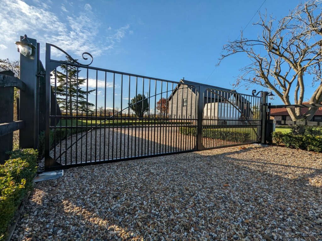 How Much Do Electric Gates Cost in the UK? 2025/2026 Pricing Guide WhatsApp Image 2024 05 18 at 18.23.42 min scaled Bespoke Metal Driveway Gate with electric automatic system, installed near Newmarket, Suffolk