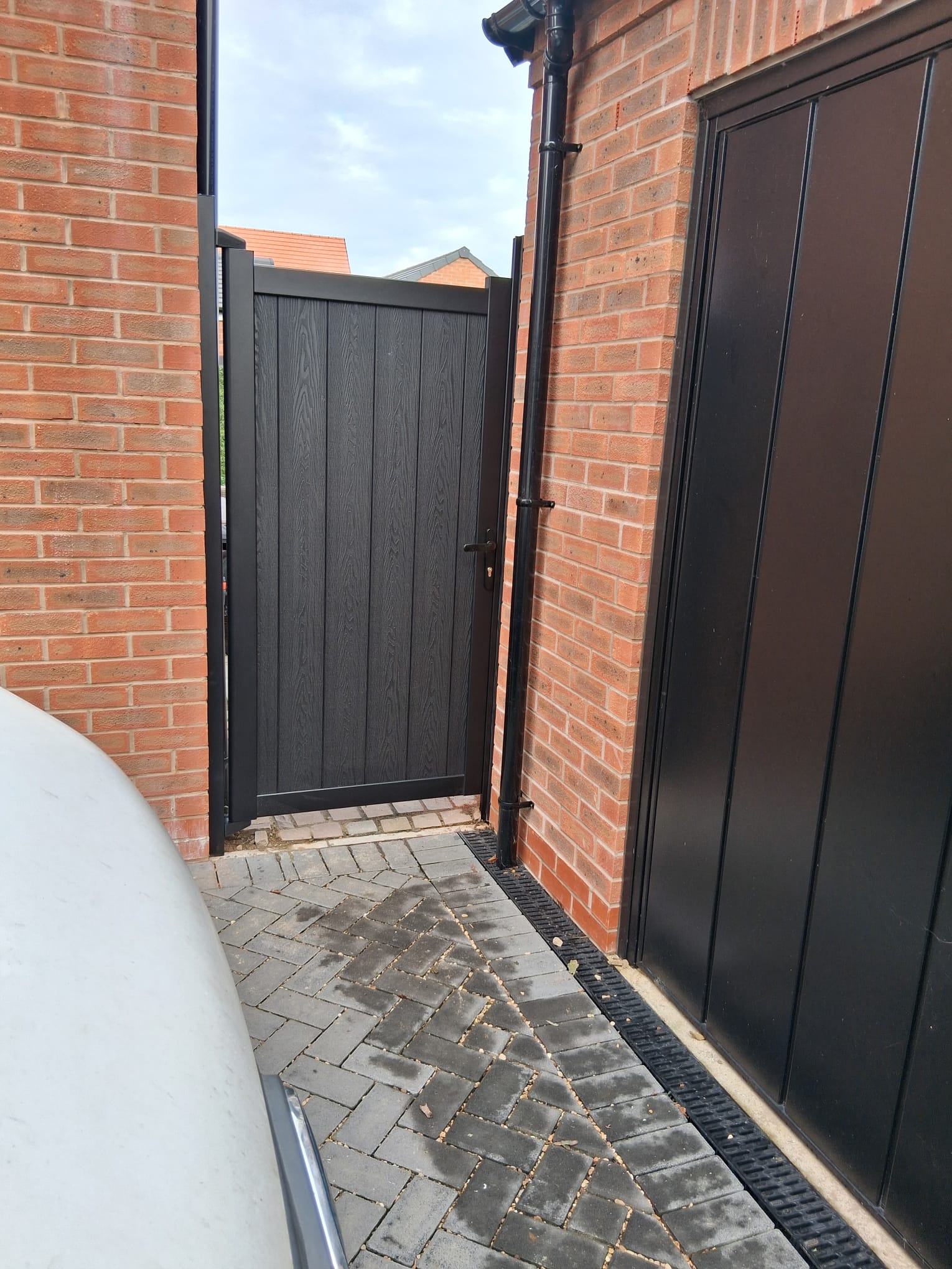 Aluminium Driveway Gates WhatsApp Image 2025 11 18 at 12.47.25 aluminium pedestrian gate with composite wood board infill